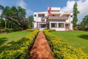StayVista's Fairfield Villa - A green lawn and charming orchard await your retreat